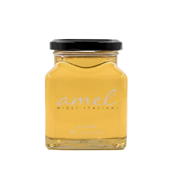 Miód akacjowy w szklanym słoiku